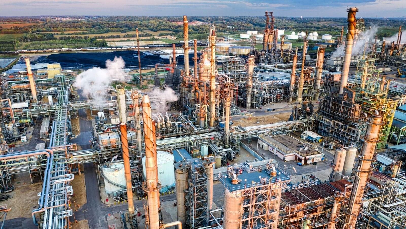 Stunning aerial shot of a large oil refinery in Rosemount, MN during sunset, showcasing industrial complexity.