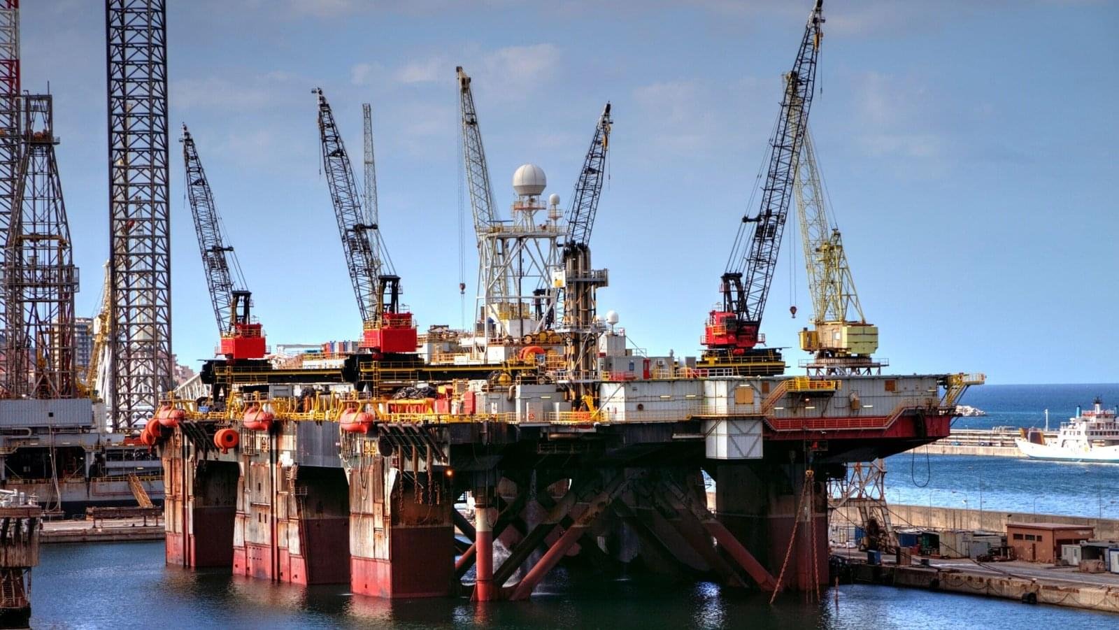 Offshore oil platform with cranes in Palermo harbor, capturing industrial and marine infrastructure.