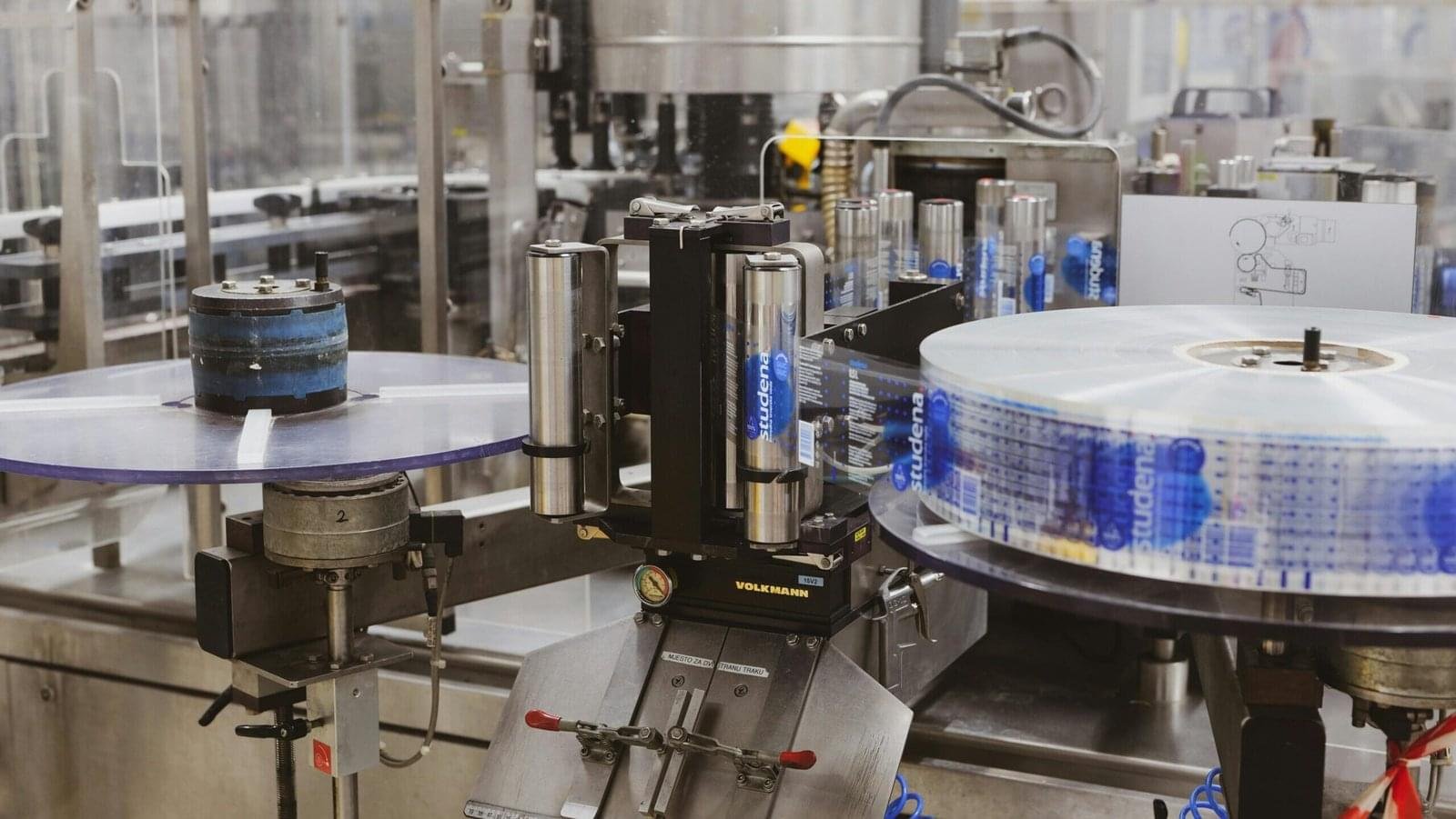 Close-up of automated machinery in a Lipik factory's production line.